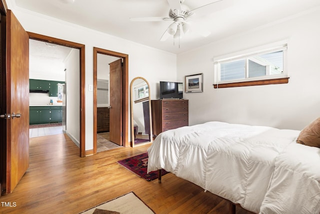 2603 Fairlawn Rd, Durham, NC 27705 - bedroom featuring wood finished floors, ornamental molding, ensuite bath, and a ceiling fan