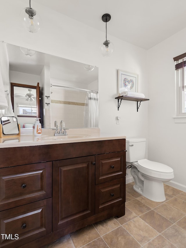 2603 Fairlawn Rd, Durham, NC 27705 - bathroom with vanity, tile patterned flooring, curtained shower, and ceiling fan