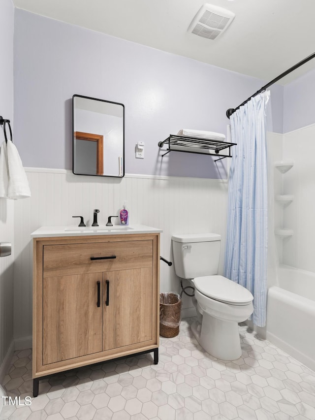 2603 Fairlawn Rd, Durham, NC 27705 - full bathroom featuring vanity, a wainscoted wall, shower / tub combo with curtain, and tile patterned floors
