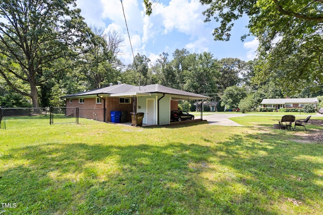 2603 Fairlawn Rd, Durham, NC 27705 - view of yard with a gate and view of wooded area