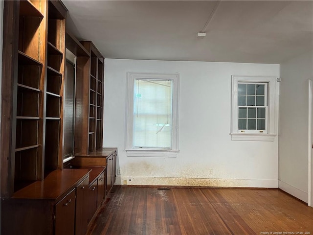 206 E 10th St, Lumberton, NC 28358 - interior space with baseboards and dark wood-type flooring