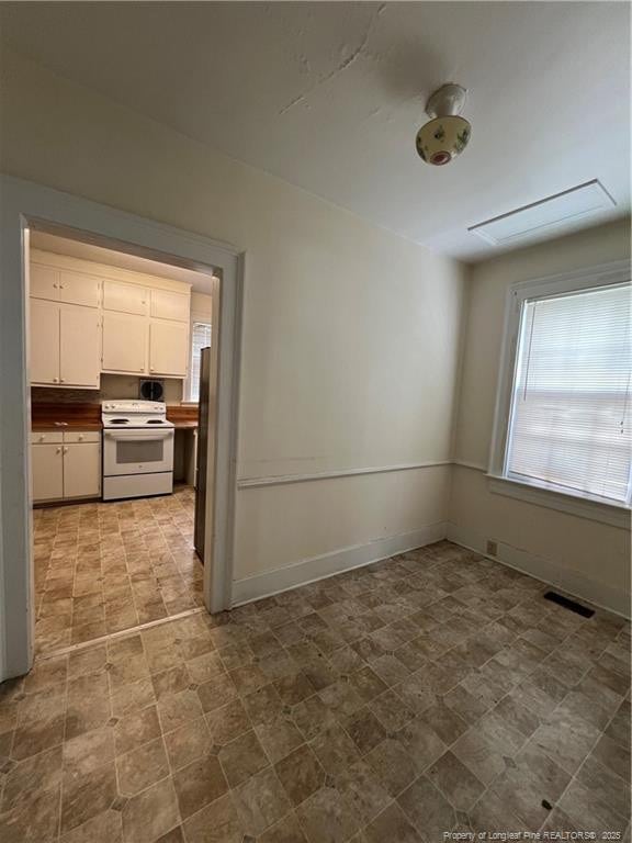 206 E 10th St, Lumberton, NC 28358 - spare room with baseboards