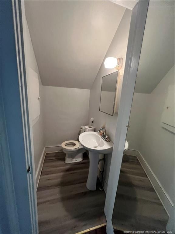 206 E 10th St, Lumberton, NC 28358 - bathroom featuring lofted ceiling and wood finished floors