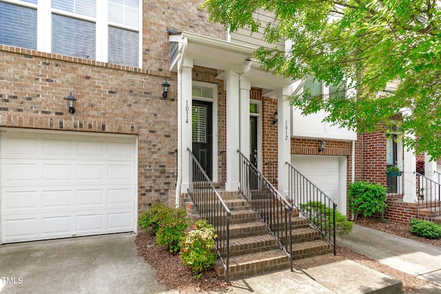 1014 Summerhouse Rd, Cary, NC 27519 - property entrance with brick siding and a garage