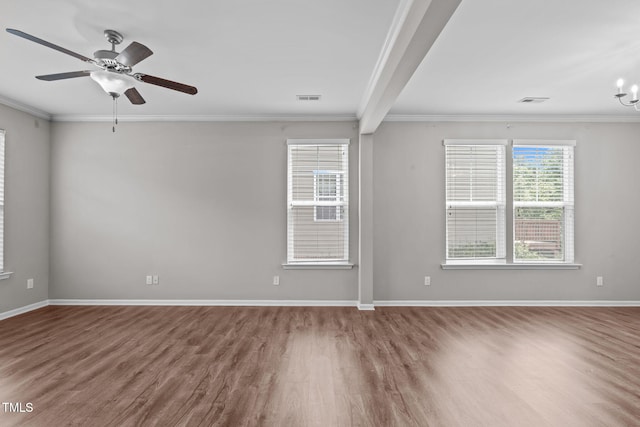 1014 Summerhouse Rd, Cary, NC 27519 - spare room featuring wood finished floors, ornamental molding, a chandelier, a ceiling fan, and beamed ceiling
