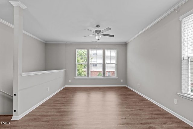 1014 Summerhouse Rd, Cary, NC 27519 - spare room featuring plenty of natural light, a ceiling fan, wood finished floors, and crown molding