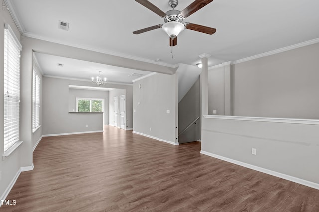 1014 Summerhouse Rd, Cary, NC 27519 - unfurnished living room with a chandelier, ceiling fan, wood finished floors, and crown molding