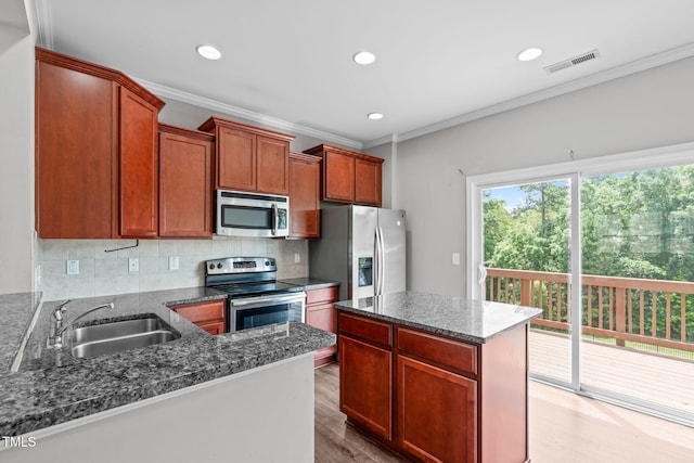 1014 Summerhouse Rd, Cary, NC 27519 - kitchen featuring appliances with stainless steel finishes, backsplash, light wood-style flooring, recessed lighting, and ornamental molding
