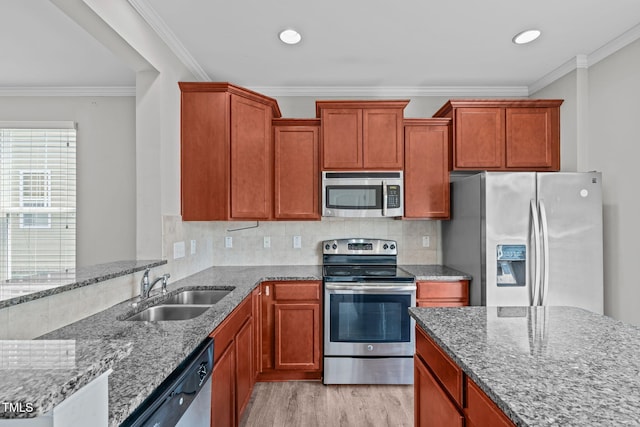 1014 Summerhouse Rd, Cary, NC 27519 - kitchen featuring stainless steel appliances, light stone countertops, light wood-style flooring, ornamental molding, and backsplash
