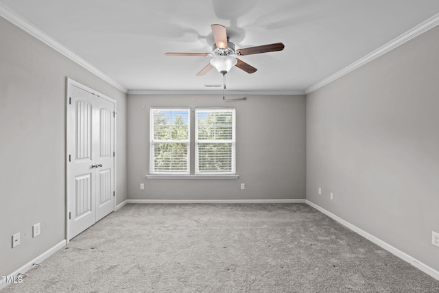 1014 Summerhouse Rd, Cary, NC 27519 - carpeted spare room featuring a ceiling fan and ornamental molding