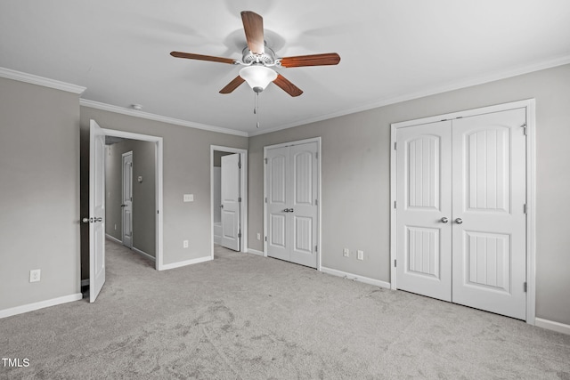 1014 Summerhouse Rd, Cary, NC 27519 - unfurnished bedroom with two closets, ornamental molding, carpet floors, and a ceiling fan