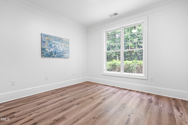 1310 Durlain Dr Unit 102, Raleigh, NC 27614 - spare room with crown molding and wood finished floors