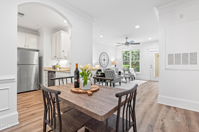 1310 Durlain Dr Unit 102, Raleigh, NC 27614 - dining room featuring ornamental molding, arched walkways, a ceiling fan, light wood-type flooring, and recessed lighting