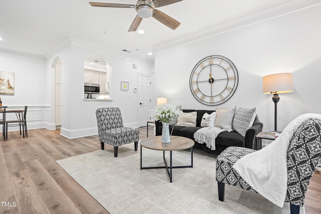 1310 Durlain Dr Unit 102, Raleigh, NC 27614 - living area with light wood-style floors, a ceiling fan, recessed lighting, ornamental molding, and arched walkways