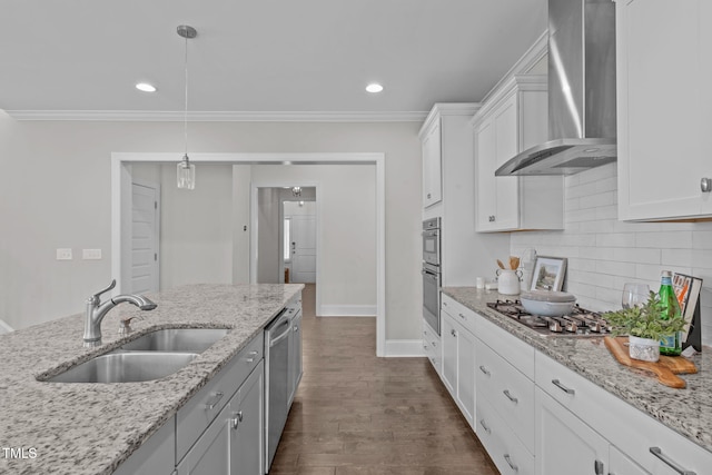 1017 Blackpool Ct, Apex, NC 27502 - kitchen with wall chimney range hood, stainless steel appliances, ornamental molding, tasteful backsplash, and white cabinets