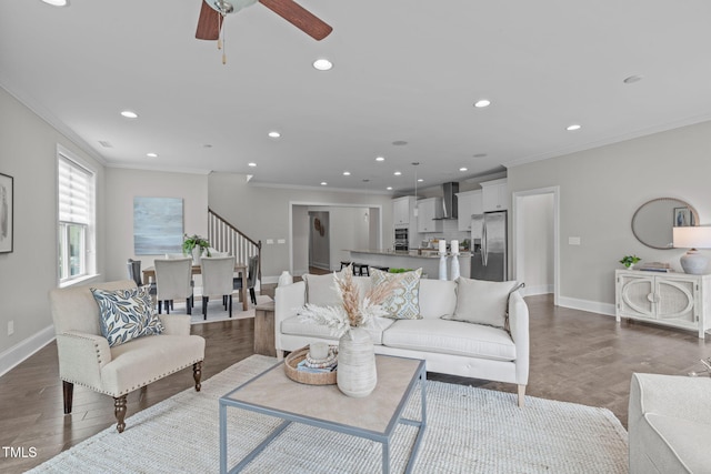 1017 Blackpool Ct, Apex, NC 27502 - living room featuring crown molding, recessed lighting, ceiling fan, stairs, and wood finished floors