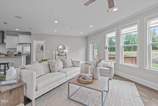 1017 Blackpool Ct, Apex, NC 27502 - living area with ornamental molding, wood finished floors, recessed lighting, and ceiling fan
