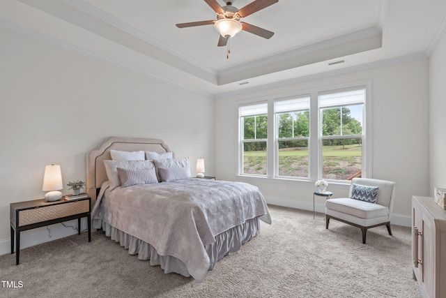 1017 Blackpool Ct, Apex, NC 27502 - bedroom featuring a tray ceiling, ornamental molding, light carpet, and a ceiling fan