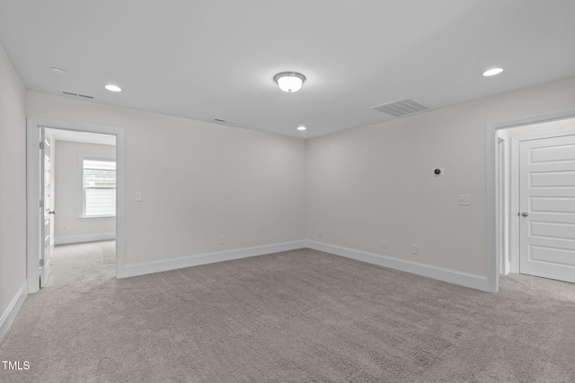 1017 Blackpool Ct, Apex, NC 27502 - spare room featuring light carpet and recessed lighting
