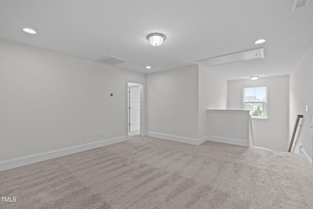 1017 Blackpool Ct, Apex, NC 27502 - carpeted spare room featuring attic access and recessed lighting