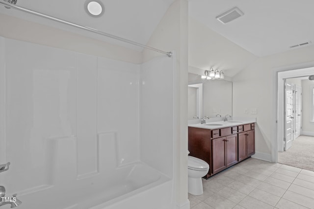 1017 Blackpool Ct, Apex, NC 27502 - bathroom with lofted ceiling, shower / washtub combination, tile patterned floors, and double vanity