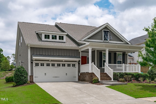 1017 Blackpool Ct, Apex, NC 27502 - craftsman house featuring a shingled roof, covered porch, driveway, a front yard, and a garage