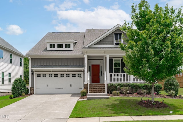 1017 Blackpool Ct, Apex, NC 27502 - craftsman house featuring covered porch, a shingled roof, a garage, a front yard, and concrete driveway