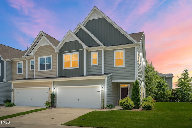 424 Shale Creek Dr, Durham, NC 27703 - view of front of home with board and batten siding, a front yard, concrete driveway, and a garage