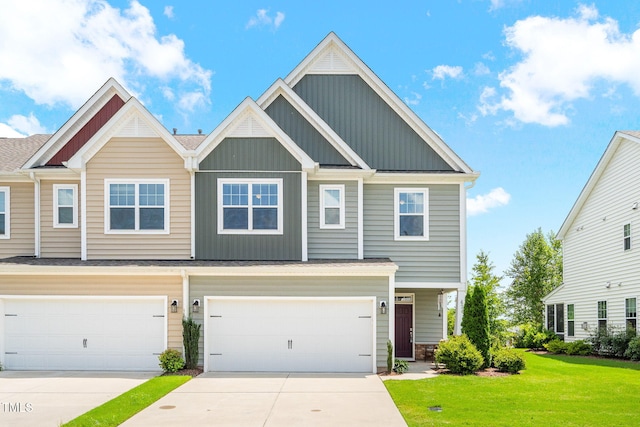 424 Shale Creek Dr, Durham, NC 27703 - craftsman house with board and batten siding, driveway, a front yard, and an attached garage