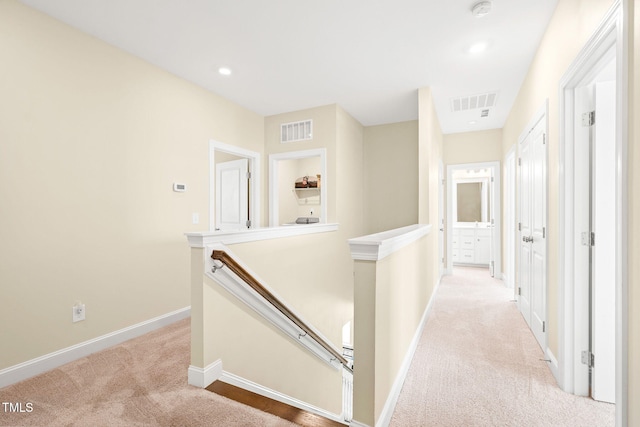 424 Shale Creek Dr, Durham, NC 27703 - hallway with an upstairs landing, light colored carpet, and recessed lighting