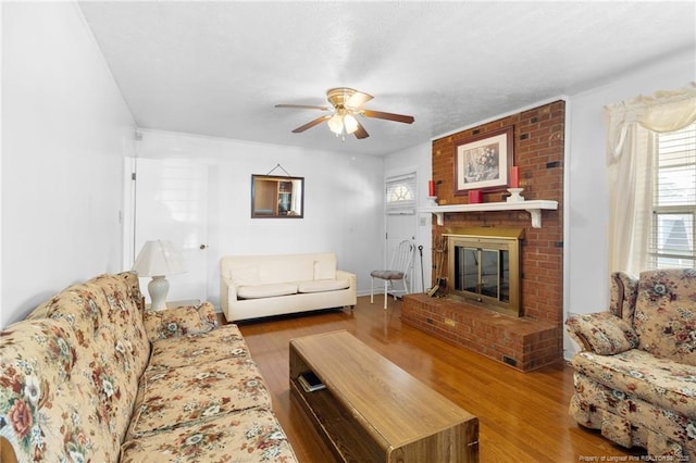 1319 Levy Dr, Fayetteville, NC 28305 - living area featuring a ceiling fan, wood finished floors, and a fireplace