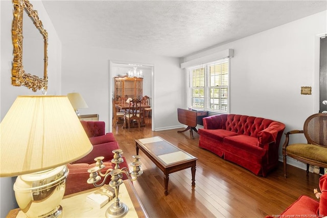 1319 Levy Dr, Fayetteville, NC 28305 - living room with wood finished floors and a textured ceiling