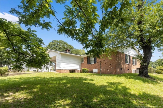 1319 Levy Dr, Fayetteville, NC 28305 - view of side of property with a yard, brick siding, and crawl space