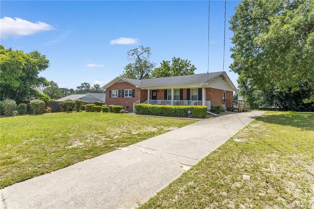 1319 Levy Dr, Fayetteville, NC 28305 - ranch-style house with covered porch, brick siding, a front yard, and driveway