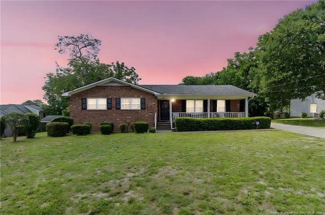 1319 Levy Dr, Fayetteville, NC 28305 - ranch-style house featuring covered porch, brick siding, and a lawn