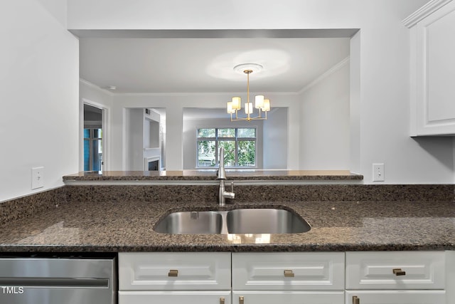 1210 Westview Ln Unit 203, Raleigh, NC 27605 - kitchen with dishwasher, crown molding, white cabinets, a chandelier, and dark stone counters