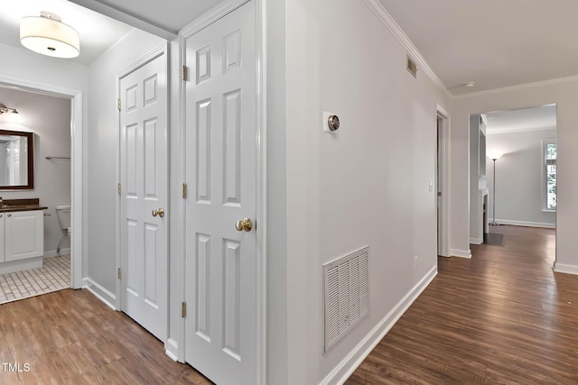 1210 Westview Ln Unit 203, Raleigh, NC 27605 - hallway featuring dark wood-type flooring and crown molding
