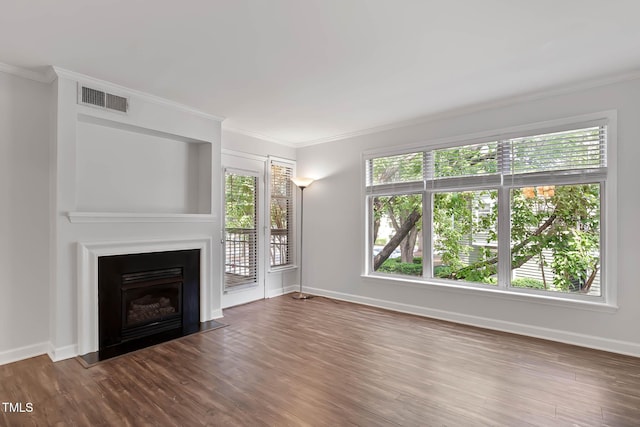 1210 Westview Ln Unit 203, Raleigh, NC 27605 - unfurnished living room featuring wood finished floors, ornamental molding, a fireplace with flush hearth, and plenty of natural light