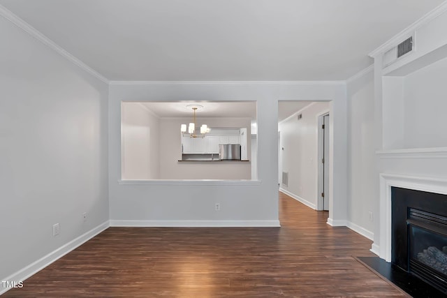 1210 Westview Ln Unit 203, Raleigh, NC 27605 - unfurnished living room featuring a chandelier, dark wood-type flooring, a fireplace with raised hearth, and crown molding