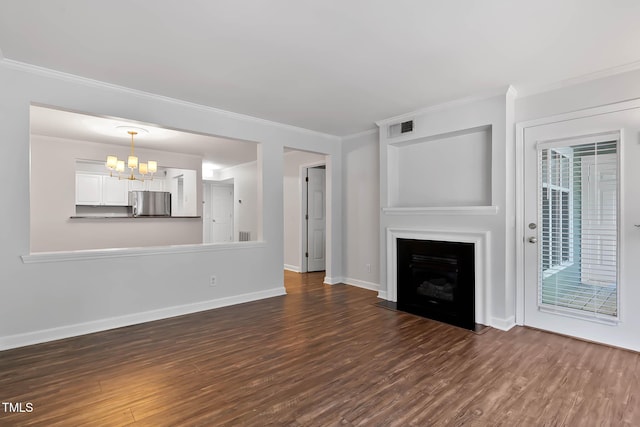 1210 Westview Ln Unit 203, Raleigh, NC 27605 - unfurnished living room featuring dark wood finished floors, a chandelier, ornamental molding, and a fireplace with flush hearth