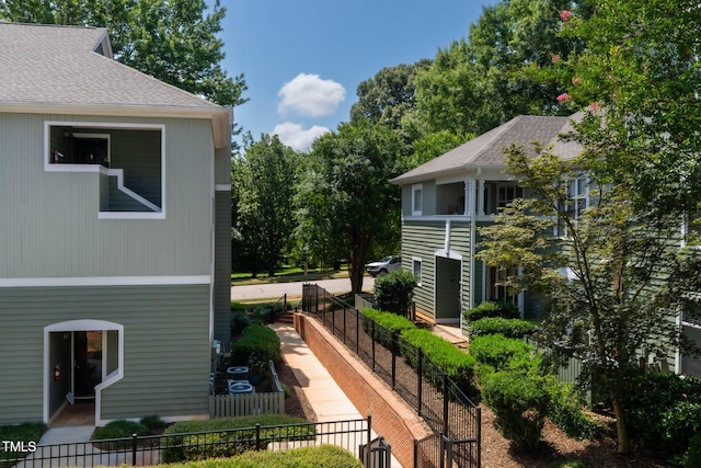 1210 Westview Ln Unit 203, Raleigh, NC 27605 - view of side of property featuring a shingled roof
