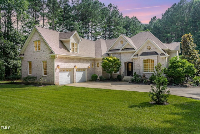 3712 Highland Creek Dr, Apex, NC 27539 - view of front of home featuring brick siding, concrete driveway, a lawn, and a shingled roof