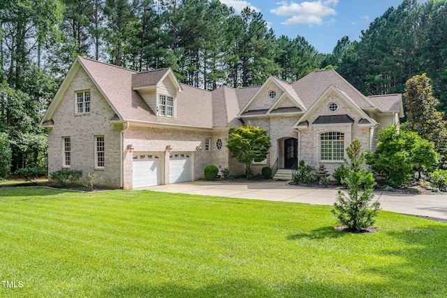3712 Highland Creek Dr, Apex, NC 27539 - view of front of house featuring a garage, brick siding, concrete driveway, and a front yard