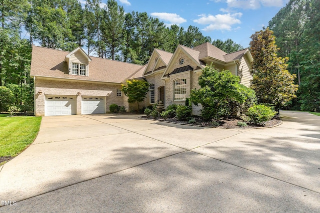 3712 Highland Creek Dr, Apex, NC 27539 - view of front of property featuring brick siding, driveway, and an attached garage