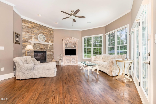 3712 Highland Creek Dr, Apex, NC 27539 - living room with ceiling fan, wood finished floors, a fireplace, and crown molding