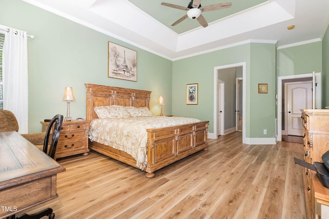 3712 Highland Creek Dr, Apex, NC 27539 - bedroom with a tray ceiling, light wood-type flooring, ornamental molding, ceiling fan, and an office area
