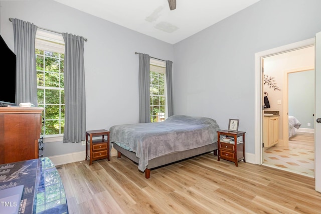 3712 Highland Creek Dr, Apex, NC 27539 - bedroom featuring light wood-style floors, lofted ceiling, ensuite bathroom, and a ceiling fan
