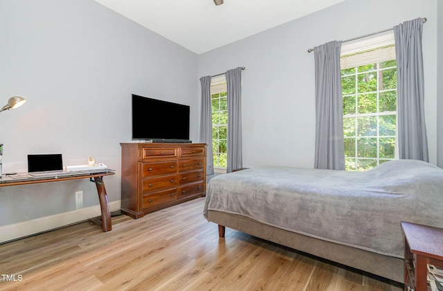 3712 Highland Creek Dr, Apex, NC 27539 - bedroom featuring wood finished floors, an office area, and a ceiling fan