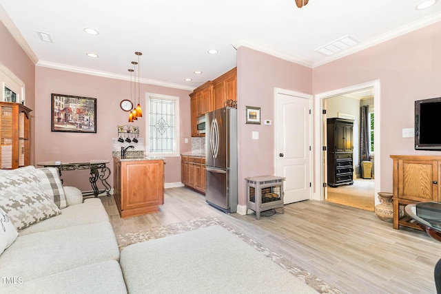 3712 Highland Creek Dr, Apex, NC 27539 - living area featuring ornamental molding, light wood-type flooring, recessed lighting, and a wood stove