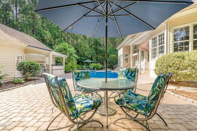 3712 Highland Creek Dr, Apex, NC 27539 - view of patio / terrace with an outdoor pool and outdoor dining area